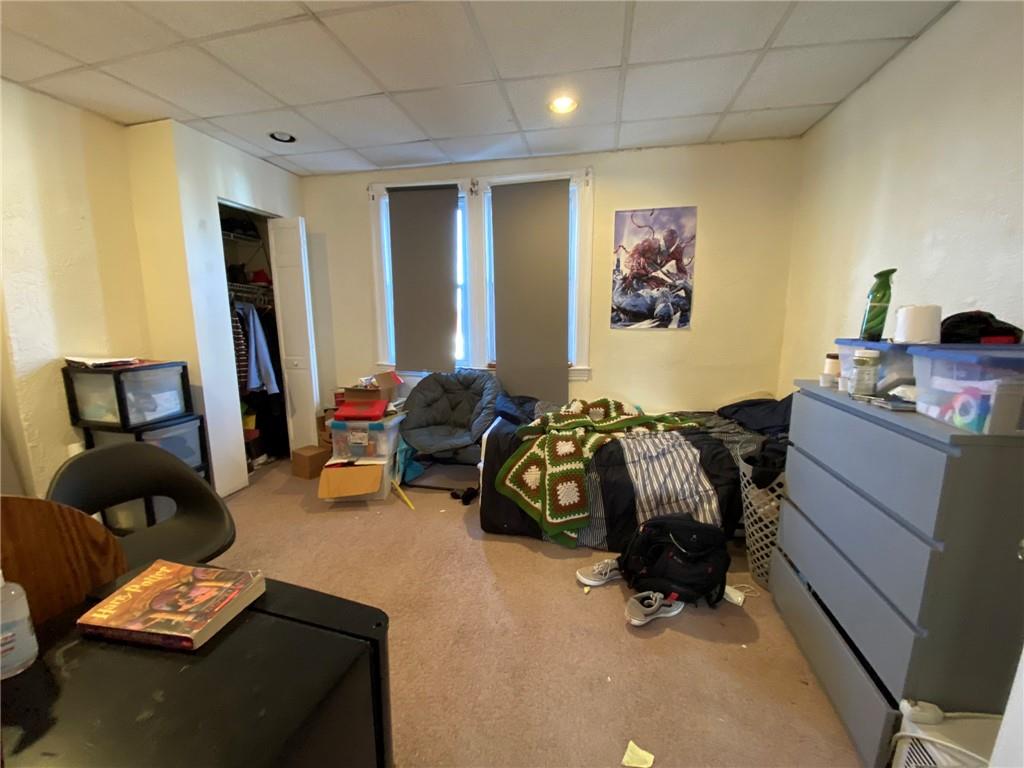 3306 Ward Street Pittsburgh, PA 15213 - Photo 5 of 12 a bedroom with furniture and a gym equipment