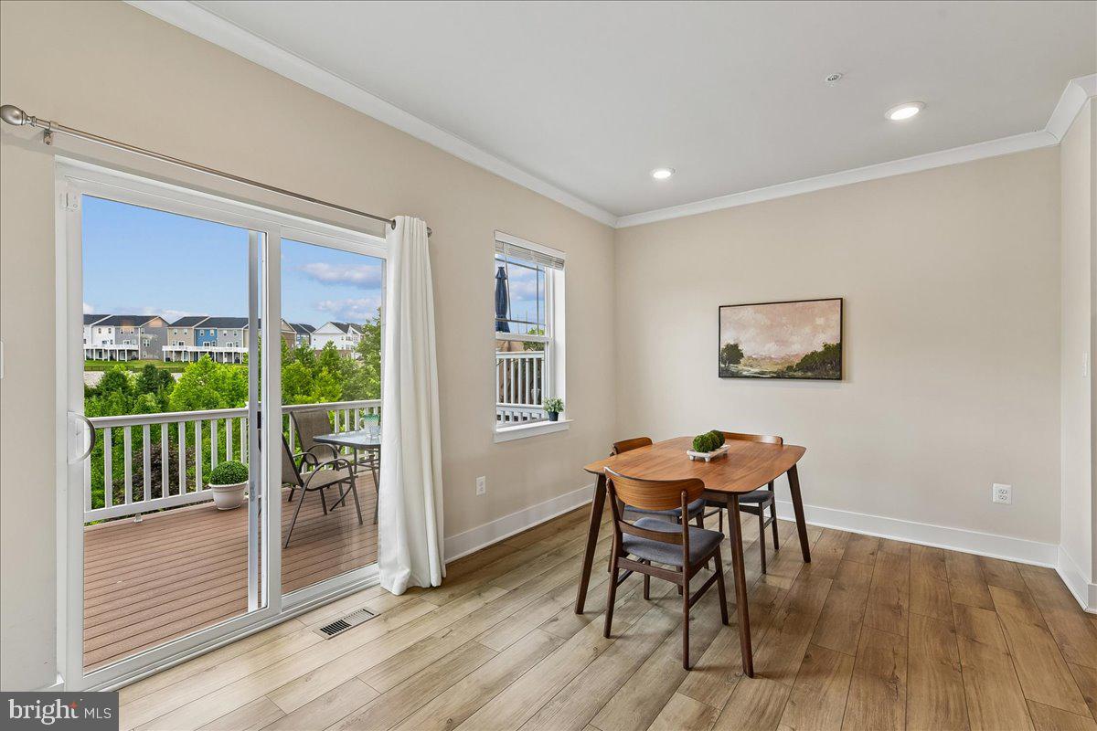 2209 Woodlands Road Windsor Mill, MD 21244 - Photo 13 of 75 DINING ROOM W/ SLIDERS TO MAIN LEVEL DECK