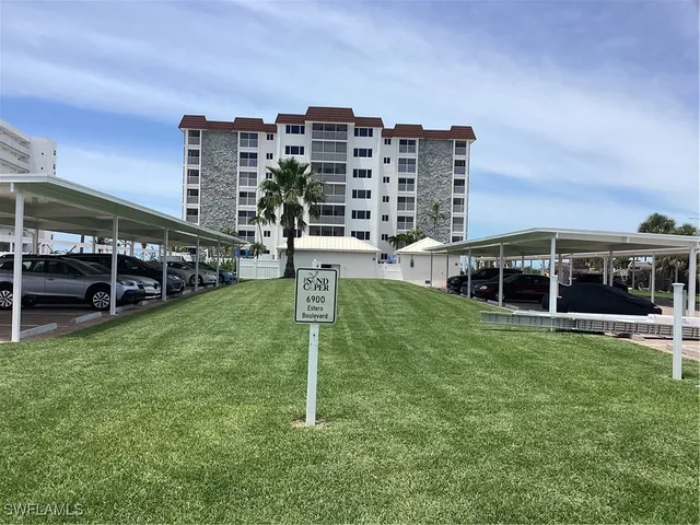 a childrens park with lots of tall trees