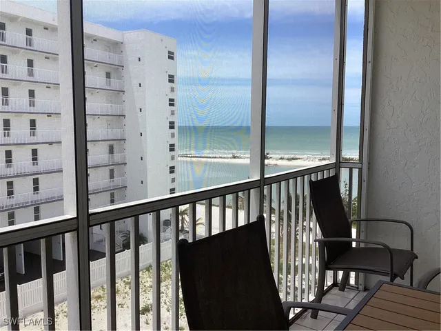 a view of a balcony with furniture