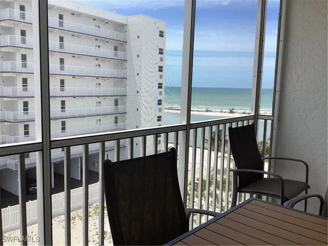 a view of a balcony with chairs
