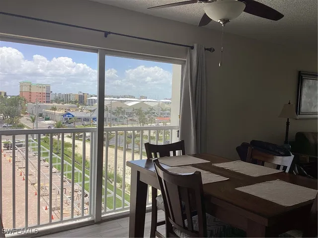 a view of a city from a dining room with furniture window and outside view