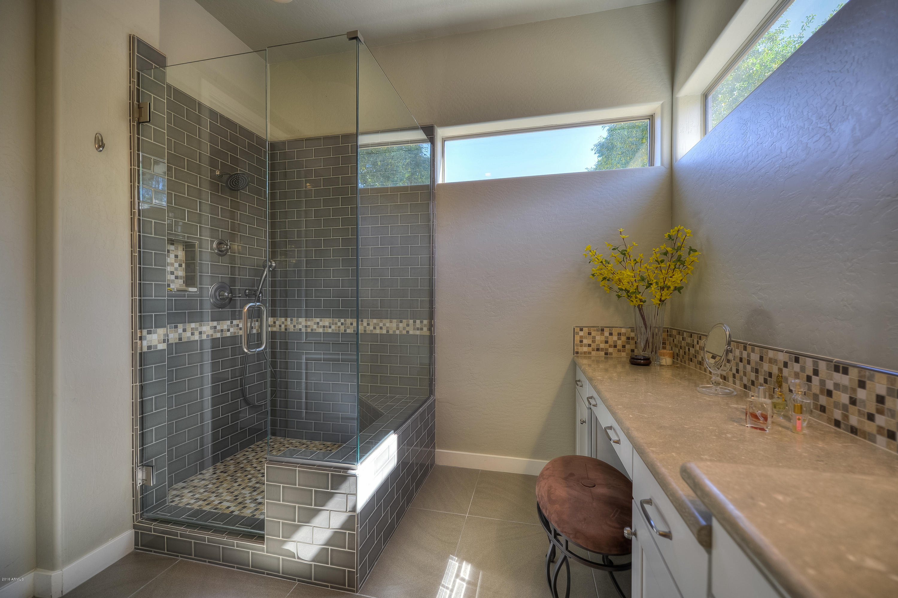 8147 East Beardsley Road Scottsdale, AZ 85255 - Photo 15 of 24 a bathroom with a granite countertop sink a toilet and shower