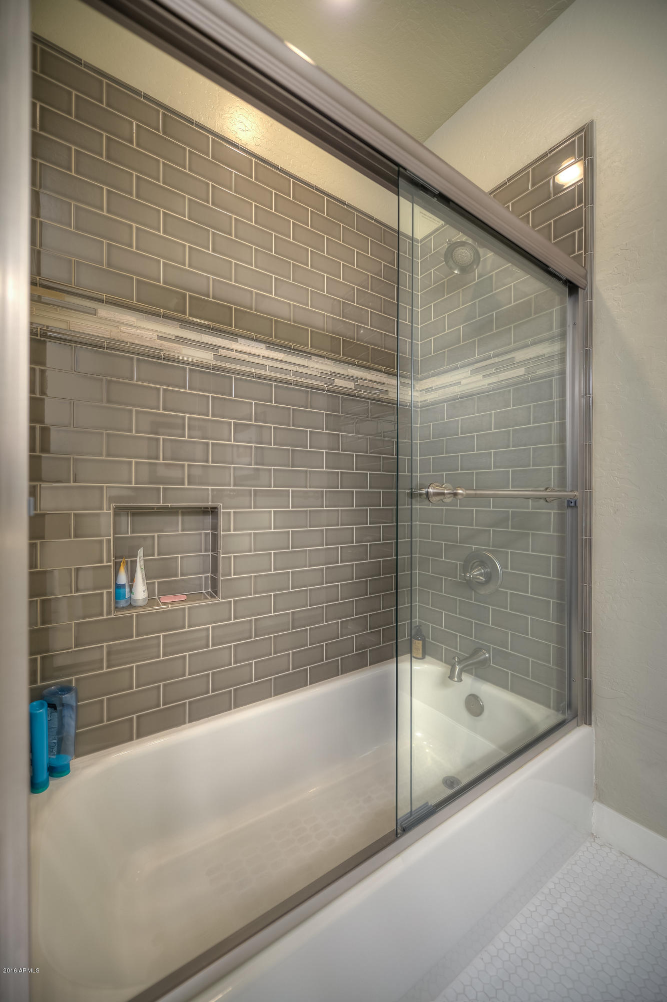 8147 East Beardsley Road Scottsdale, AZ 85255 - Photo 18 of 24 a bathroom with a bathtub and a shower