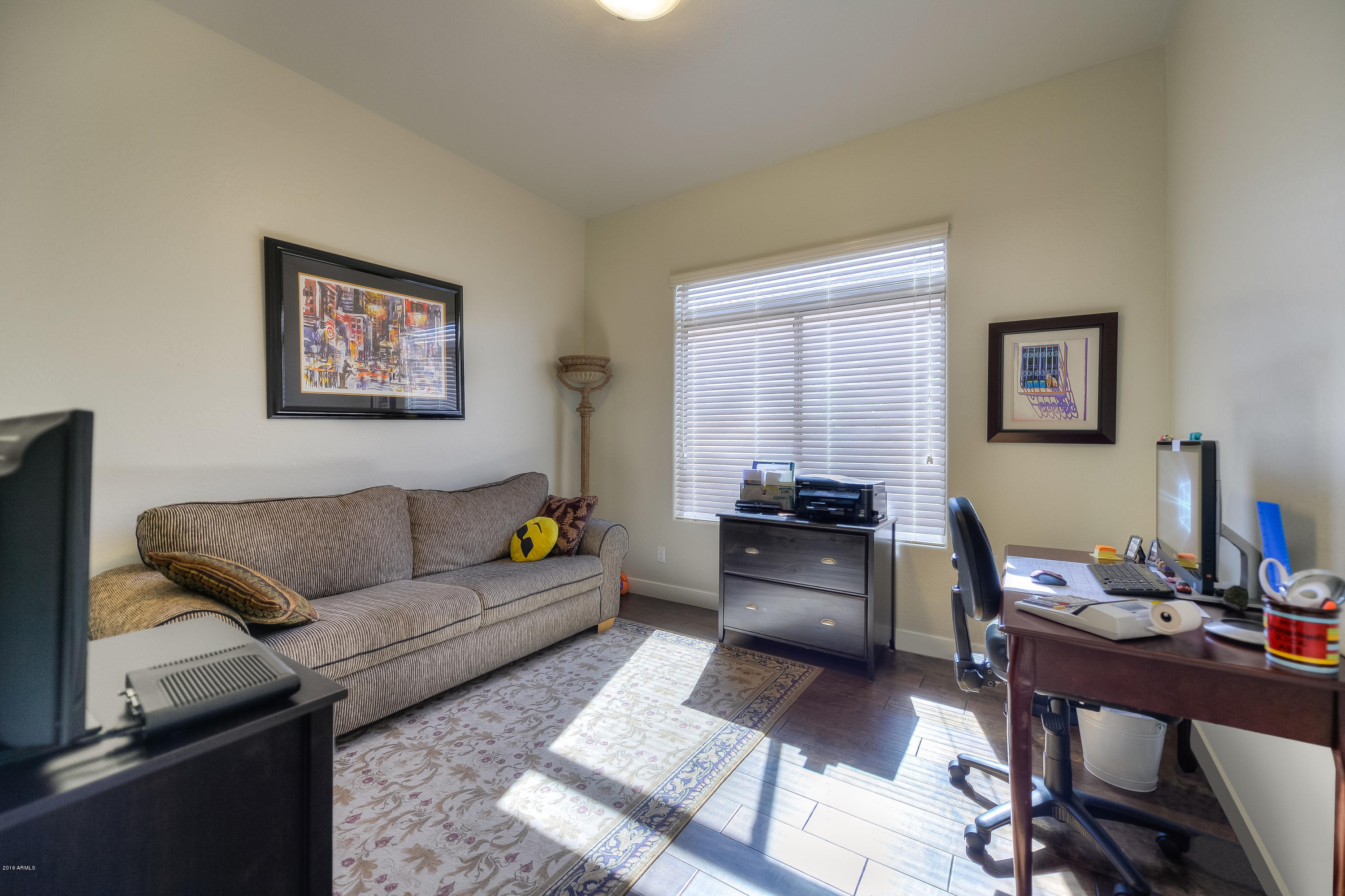 8147 East Beardsley Road Scottsdale, AZ 85255 - Photo 19 of 24 a living room with furniture and a wooden floor