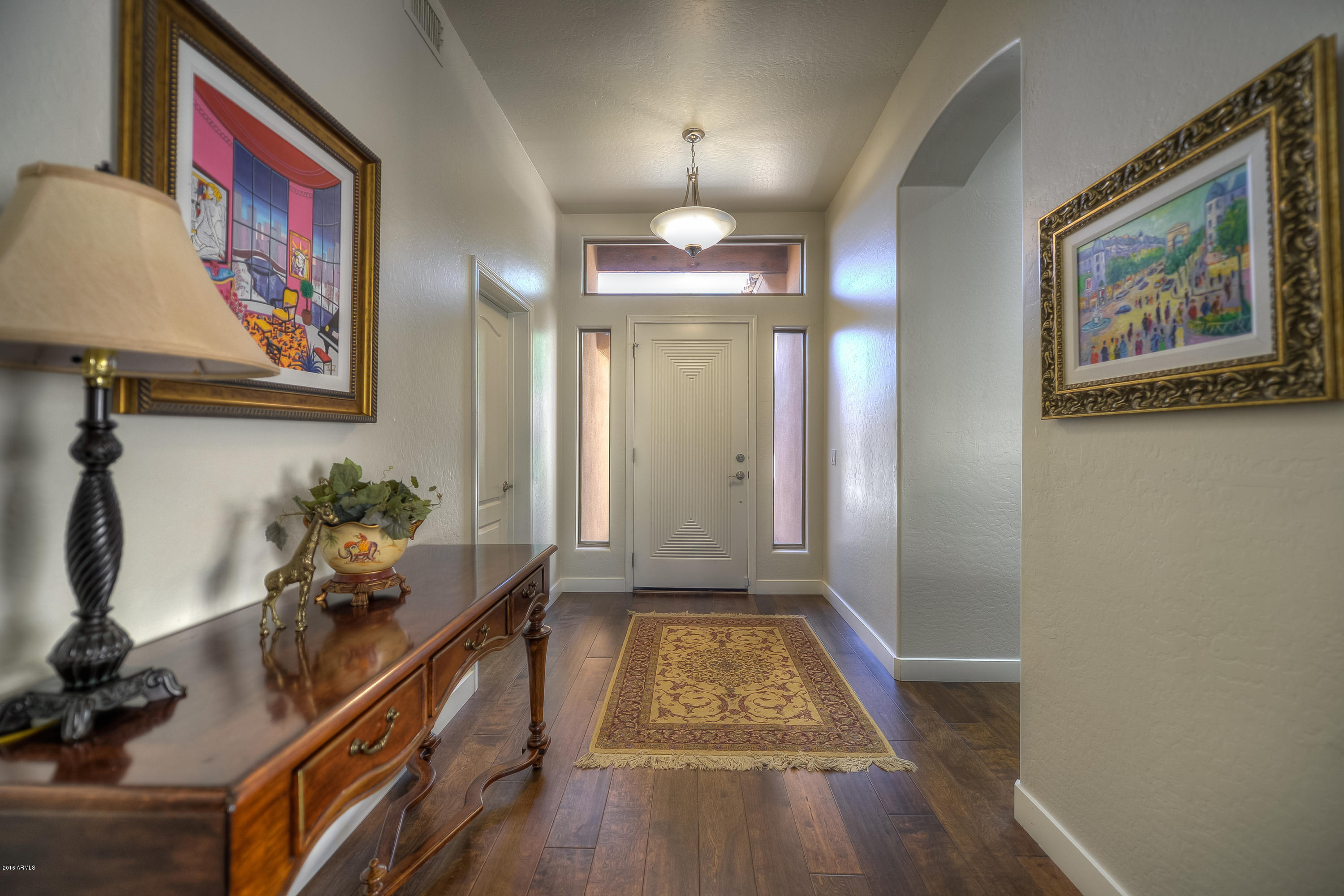 8147 East Beardsley Road Scottsdale, AZ 85255 - Photo 3 of 24 a view of gallery with wooden floor
