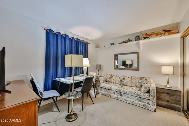a view of a livingroom with furniture and a table