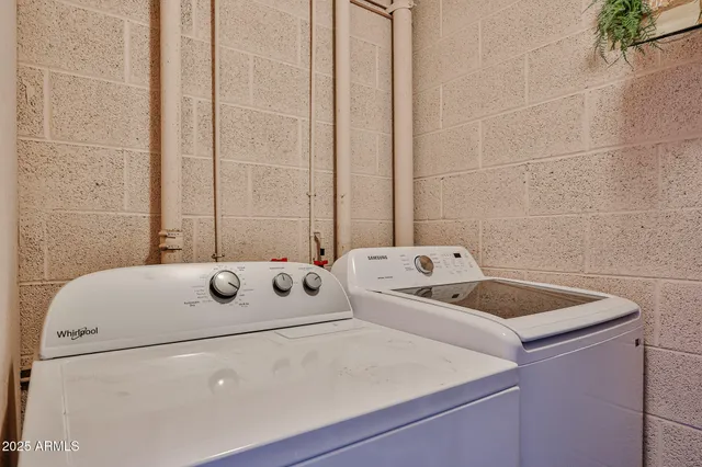 a bathroom with a sink and a washing machine