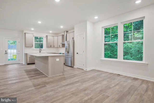a kitchen with a stove and a sink