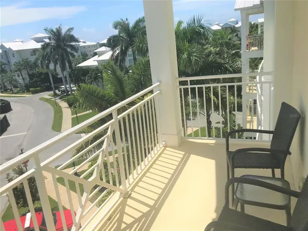 a view of balcony with furniture