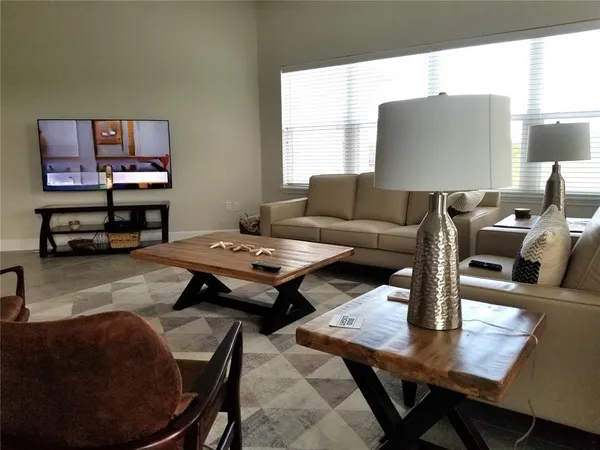 a living room with furniture and a table