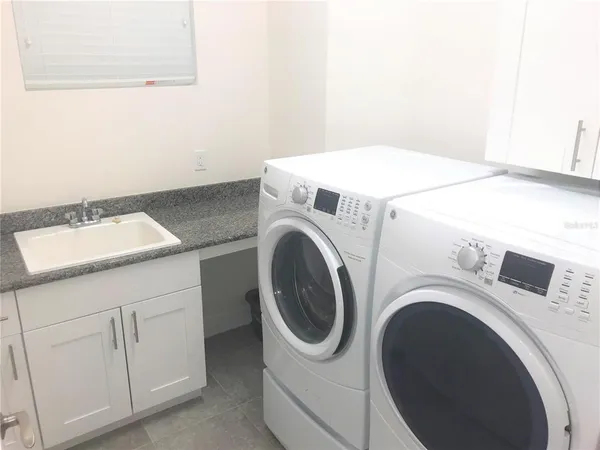 a utility room with dryer and washer
