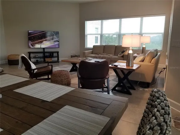 a living room with furniture and a window