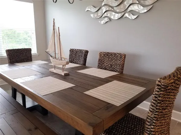 a view of a dining room with furniture