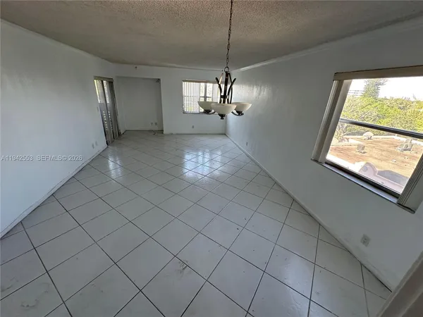 a view of a livingroom with windows