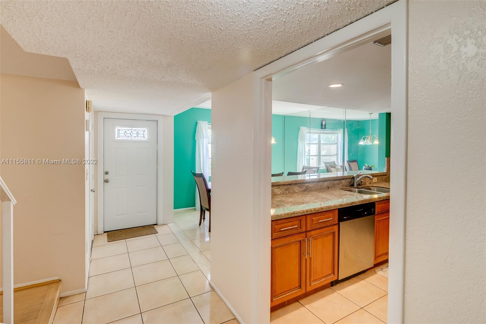 4106 Inverrary Drive, Unit 13C Lauderhill, FL 33319 - Photo 13 of 46 a bathroom with a sink a mirror and a shower