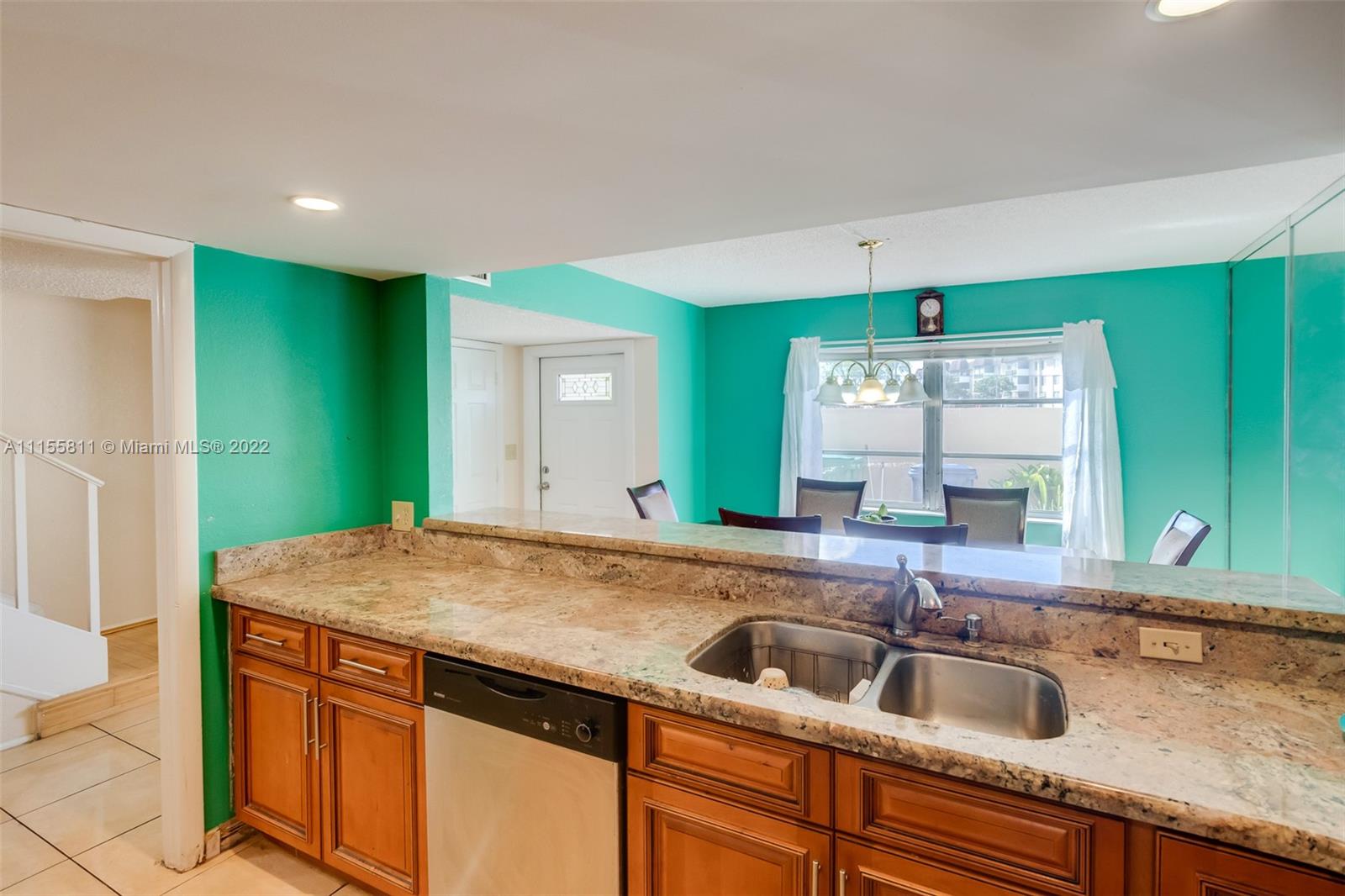 4106 Inverrary Drive, Unit 13C Lauderhill, FL 33319 - Photo 16 of 46 a kitchen with a sink and a refrigerator
