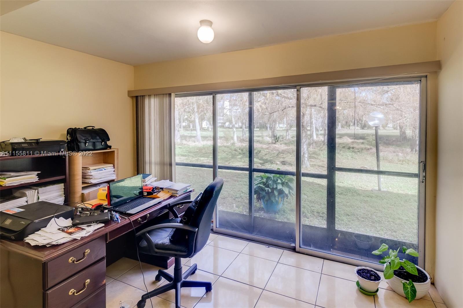 4106 Inverrary Drive, Unit 13C Lauderhill, FL 33319 - Photo 22 of 46 a view of a workspace with furniture and a window