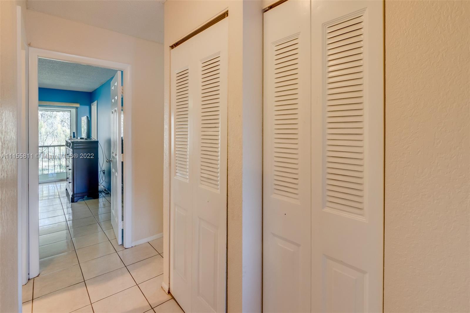 4106 Inverrary Drive, Unit 13C Lauderhill, FL 33319 - Photo 28 of 46 a view of a hallway with closet and bathroom