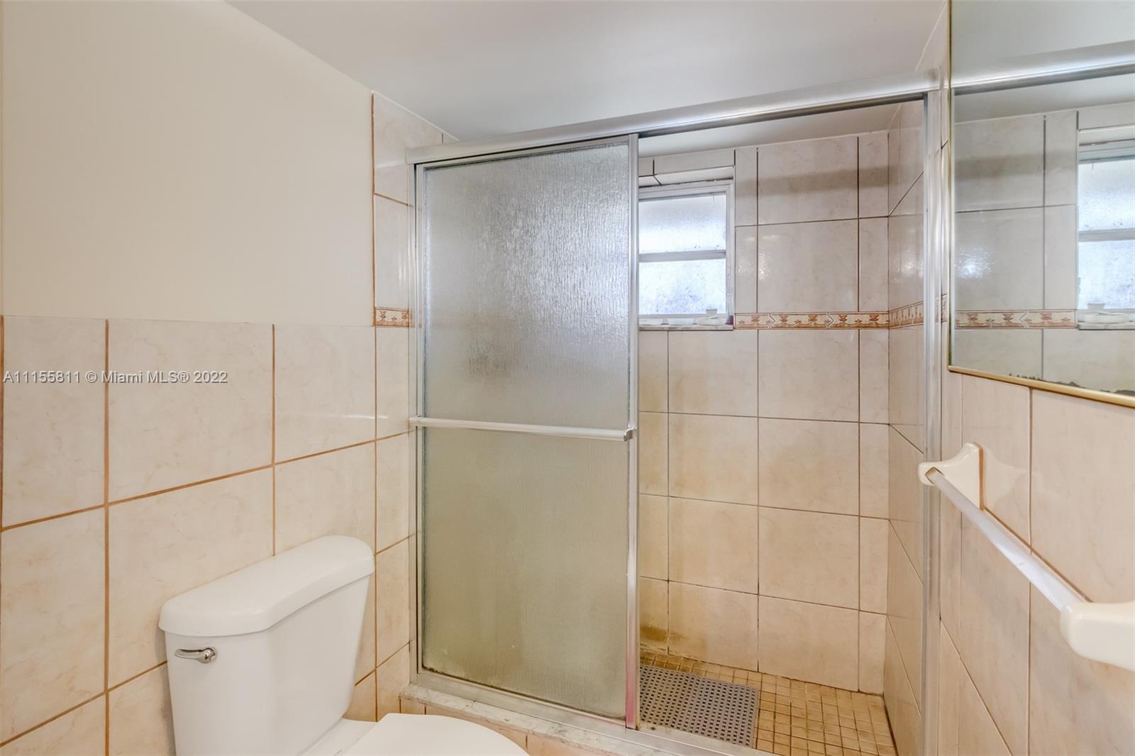 4106 Inverrary Drive, Unit 13C Lauderhill, FL 33319 - Photo 35 of 46 a bathroom with a shower and a toilet