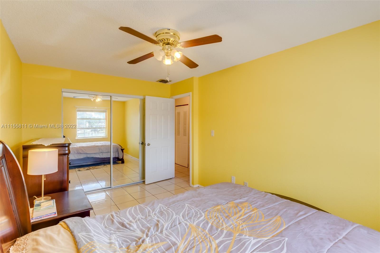 4106 Inverrary Drive, Unit 13C Lauderhill, FL 33319 - Photo 40 of 46 a bedroom with a bed and a couch