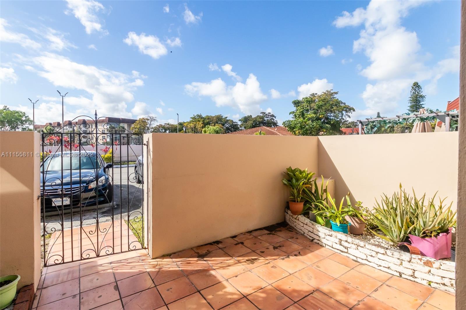 4106 Inverrary Drive, Unit 13C Lauderhill, FL 33319 - Photo 4 of 46 a view of a terrace with a water fountain and potted plants