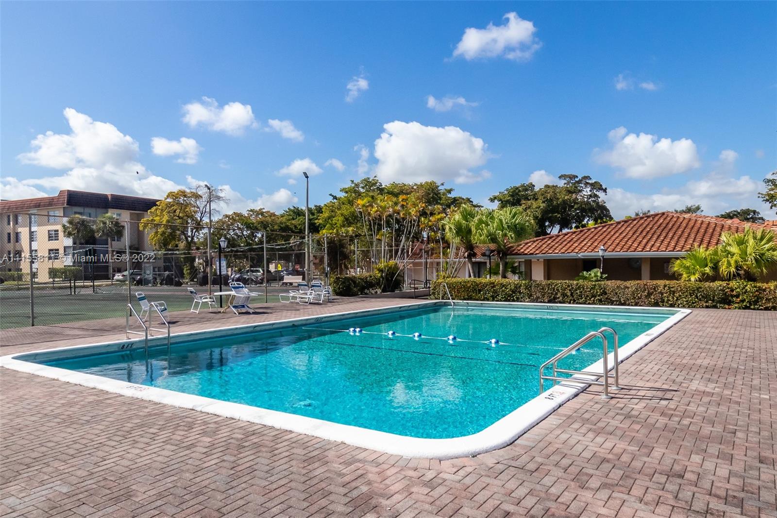 4106 Inverrary Drive, Unit 13C Lauderhill, FL 33319 - Photo 46 of 46 a view of a swimming pool with outdoor seating