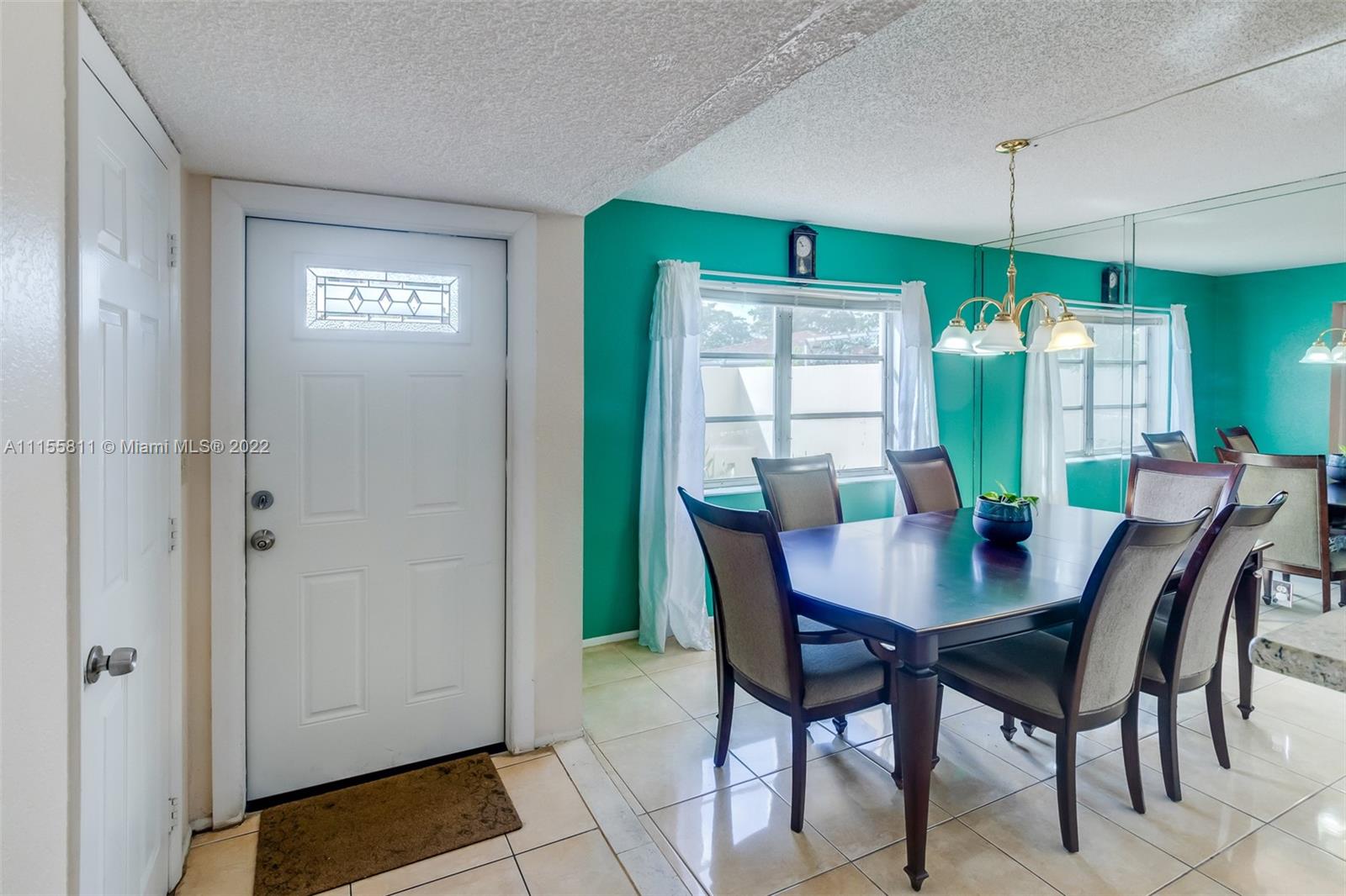 4106 Inverrary Drive, Unit 13C Lauderhill, FL 33319 - Photo 7 of 46 a view of a dining room with furniture and window
