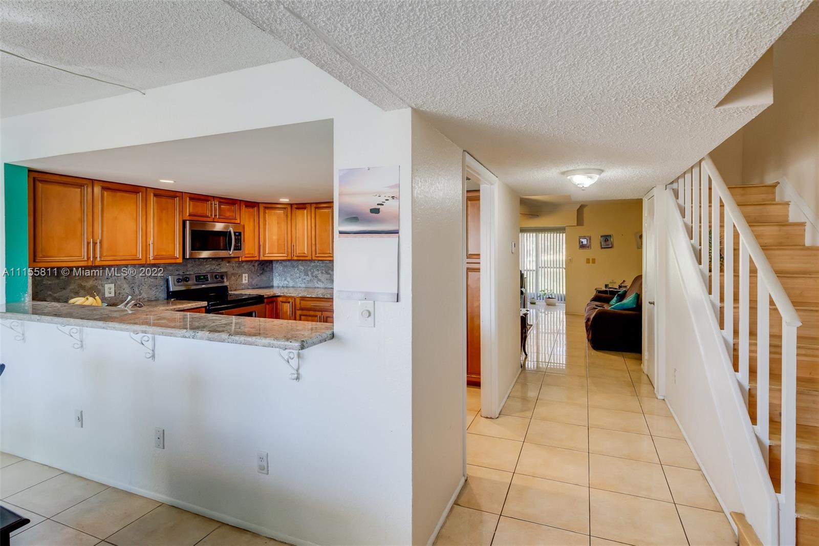 4106 Inverrary Drive, Unit 13C Lauderhill, FL 33319 - Photo 8 of 46 a view of a kitchen with a sink and a window