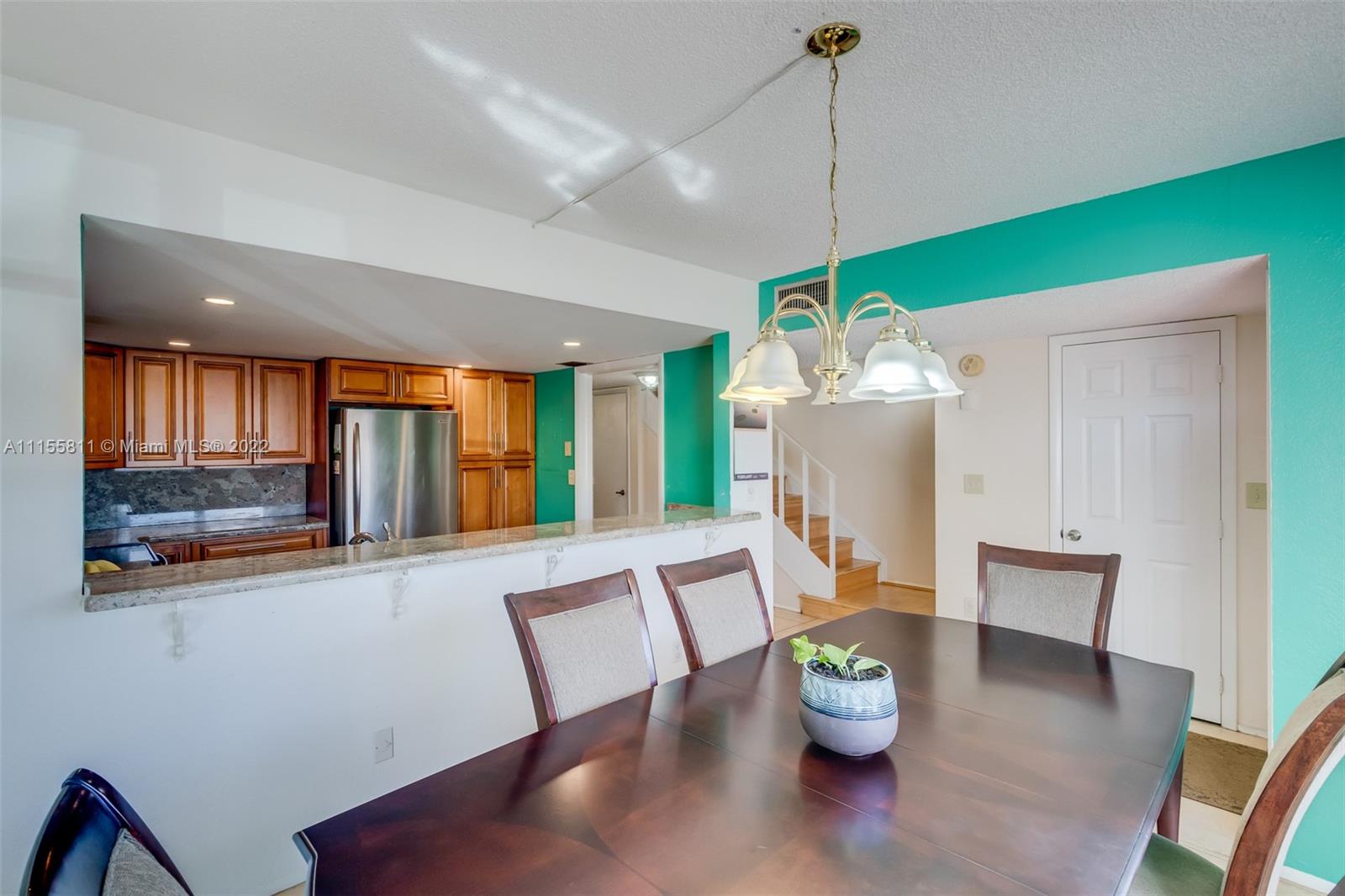 4106 Inverrary Drive, Unit 13C Lauderhill, FL 33319 - Photo 10 of 46 a dining room with furniture window wooden floor