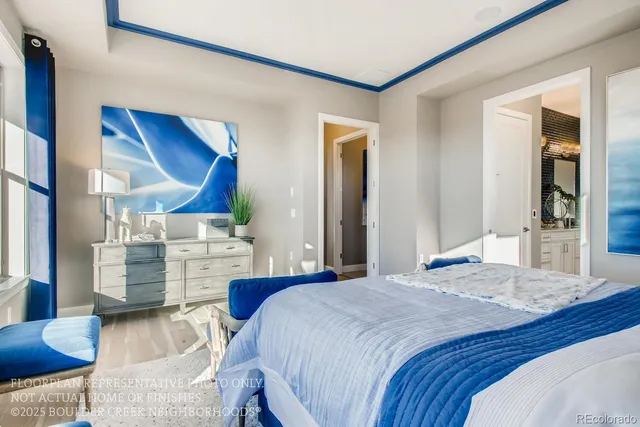 a bedroom with a bed and a view mirror