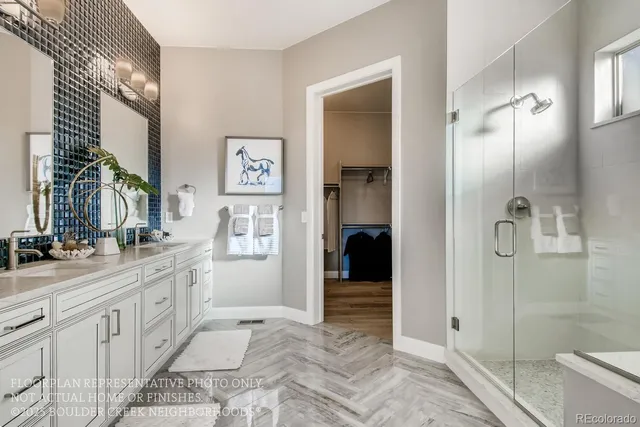 a spacious bathroom with a granite countertop sink mirror and shower