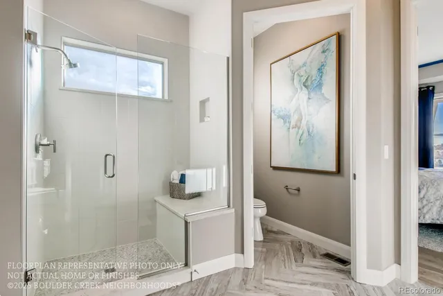 a bathroom with a shower and a sink