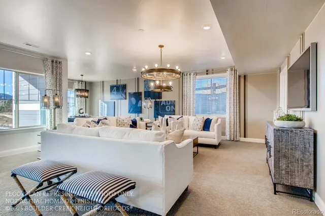 a living room with furniture and a chandelier