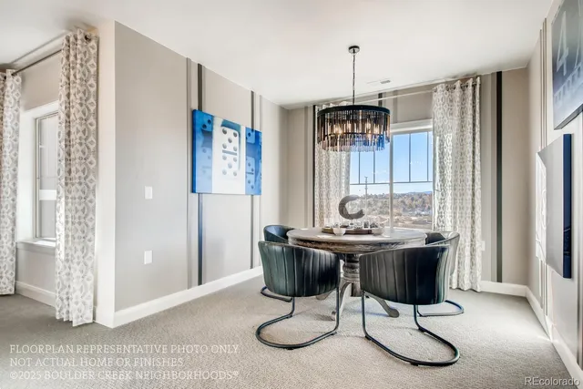 a view of a livingroom with furniture wooden floor and a chandelier