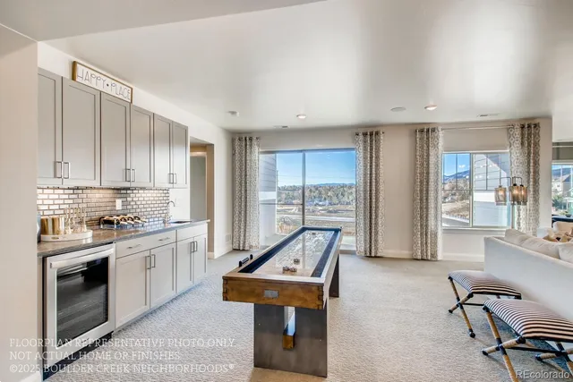 a kitchen with furniture a counter top space a sink stainless steel appliances and cabinets