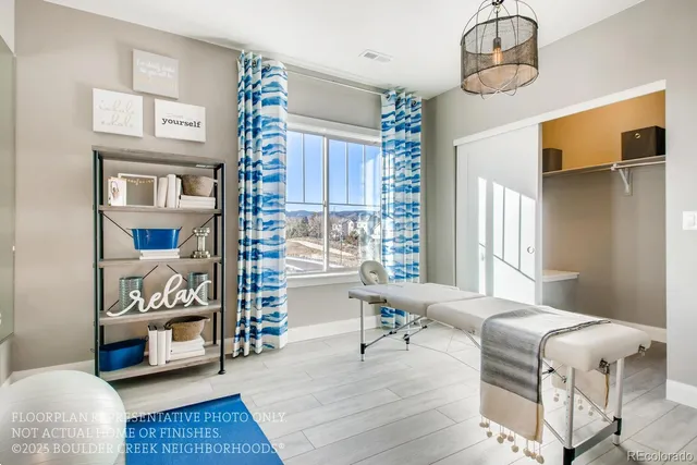 a bedroom with furniture and a window