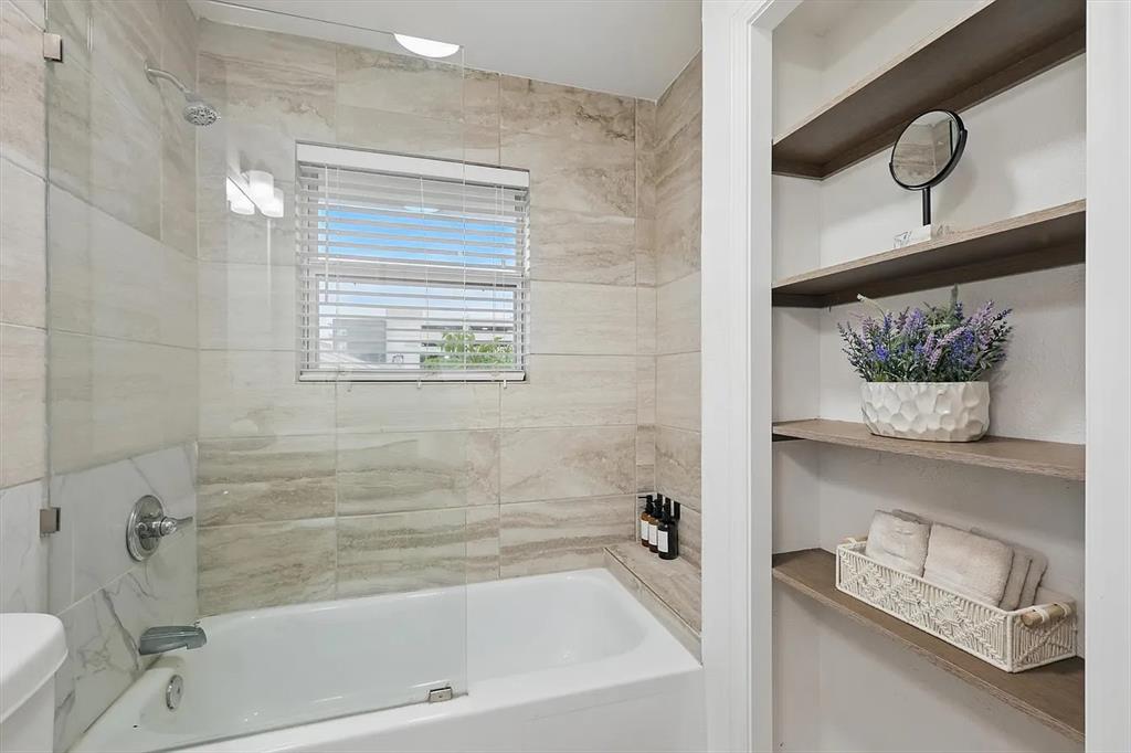 8083 Meadow Road, Unit 265 Dallas, TX 75231 - Photo 14 of 22 Bathroom with tub / shower combination and toilet