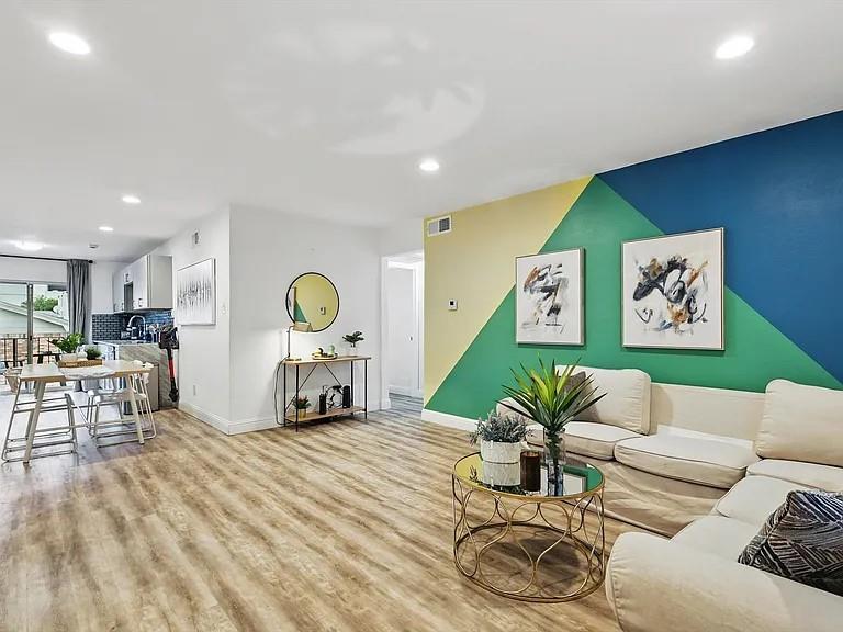 8083 Meadow Road, Unit 265 Dallas, TX 75231 - Photo 5 of 22 Living area with wood finished floors and recessed lighting