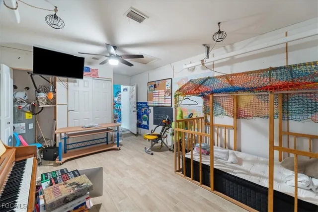 a room with lots of furniture and a flat screen tv