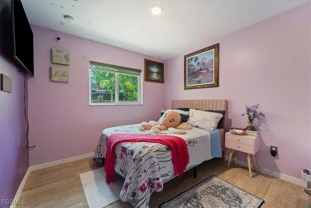 a bed room with a bed and a tv