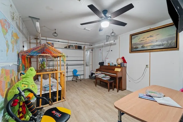 a bedroom with furniture and a chandelier
