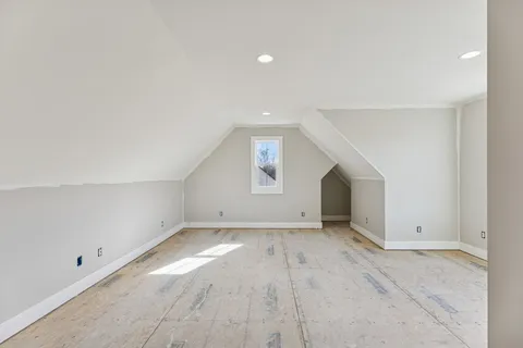 an empty room with a empty space and windows