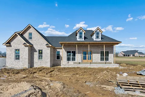 a front view of a house with a yard