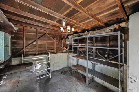 a view of a room with wooden shelves