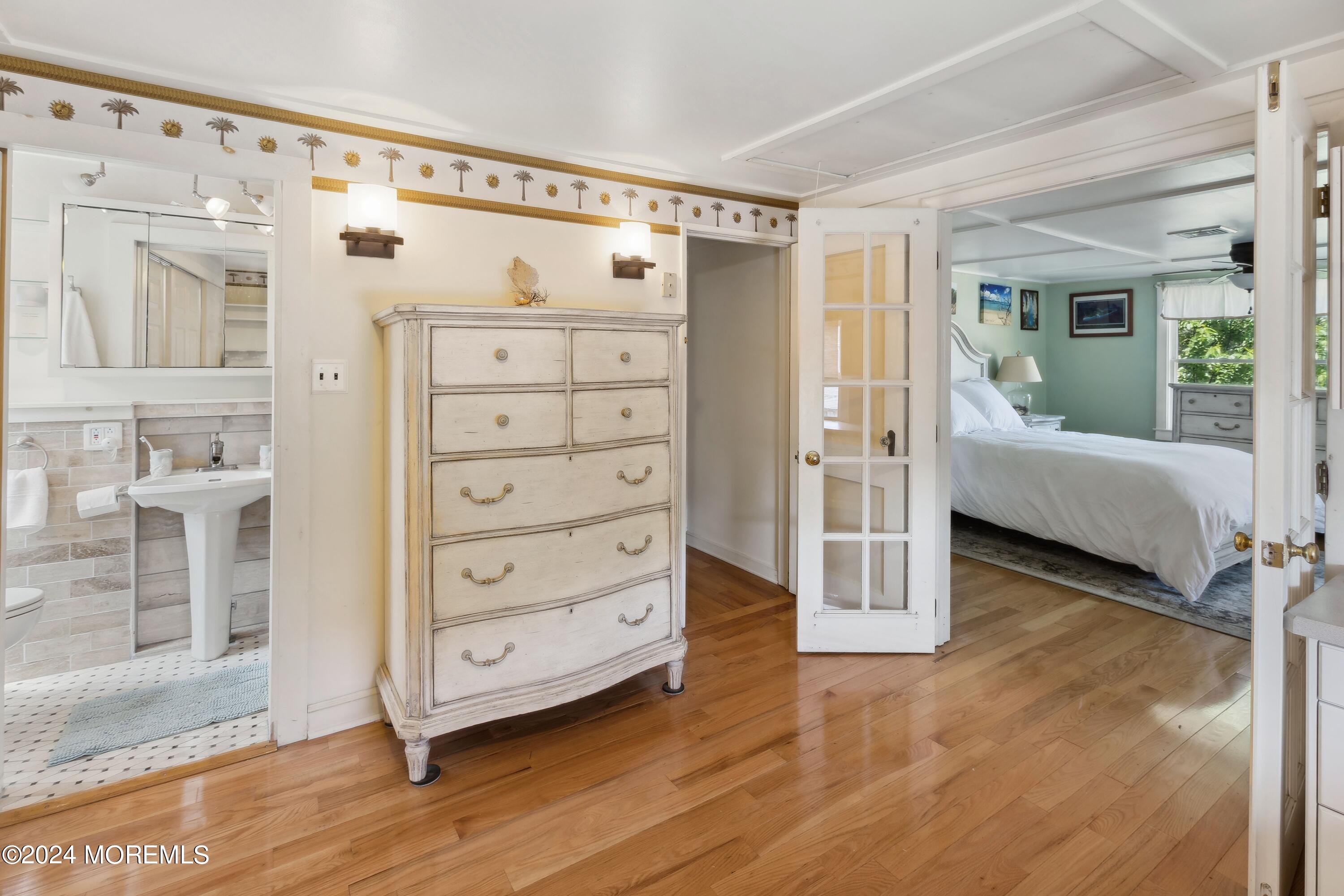 1119 Sampson Road Point Pleasant, NJ 08742 - Photo 16 of 29 a view of a bedroom with furniture and wooden floor