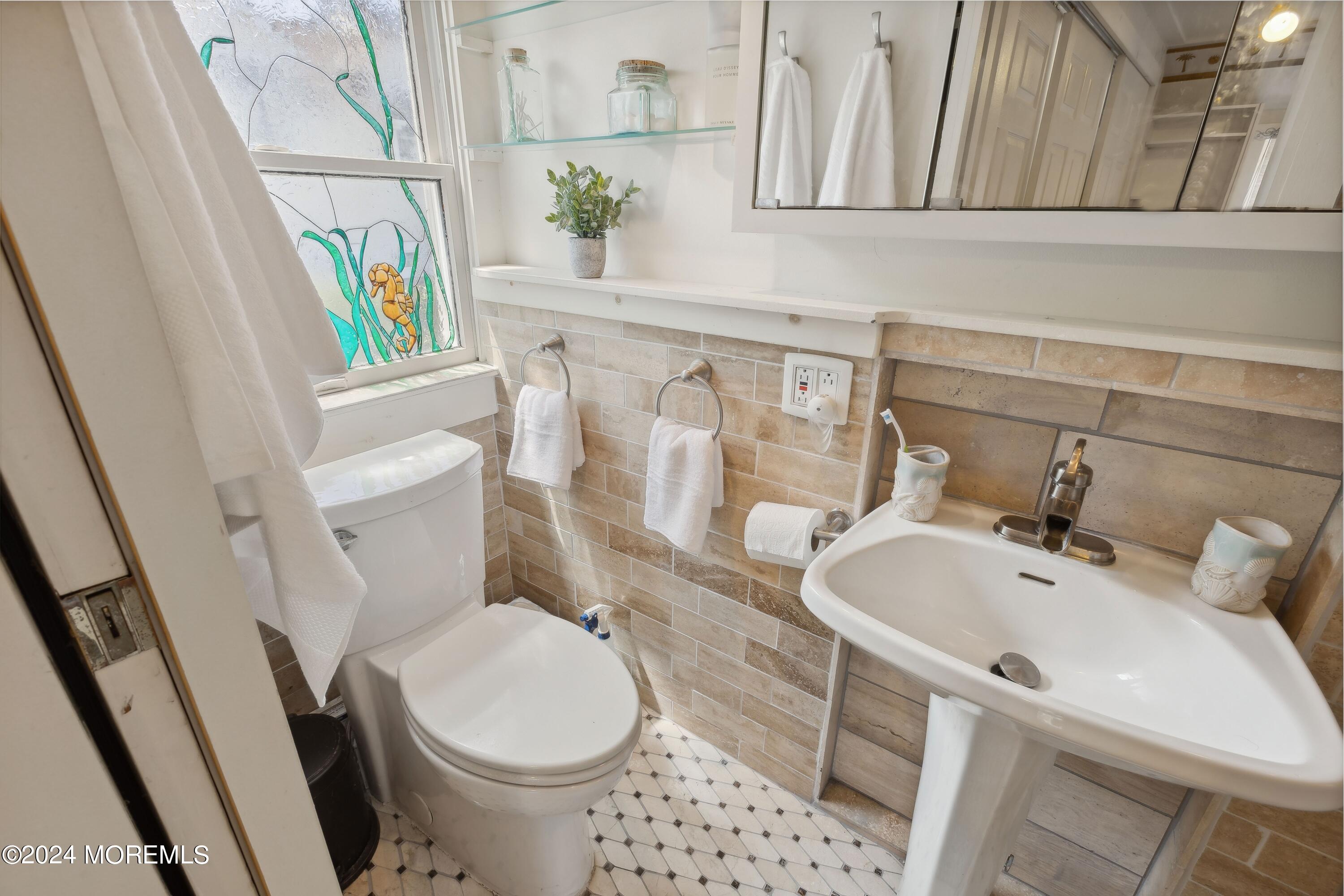 1119 Sampson Road Point Pleasant, NJ 08742 - Photo 18 of 29 a bathroom with a sink and toilet