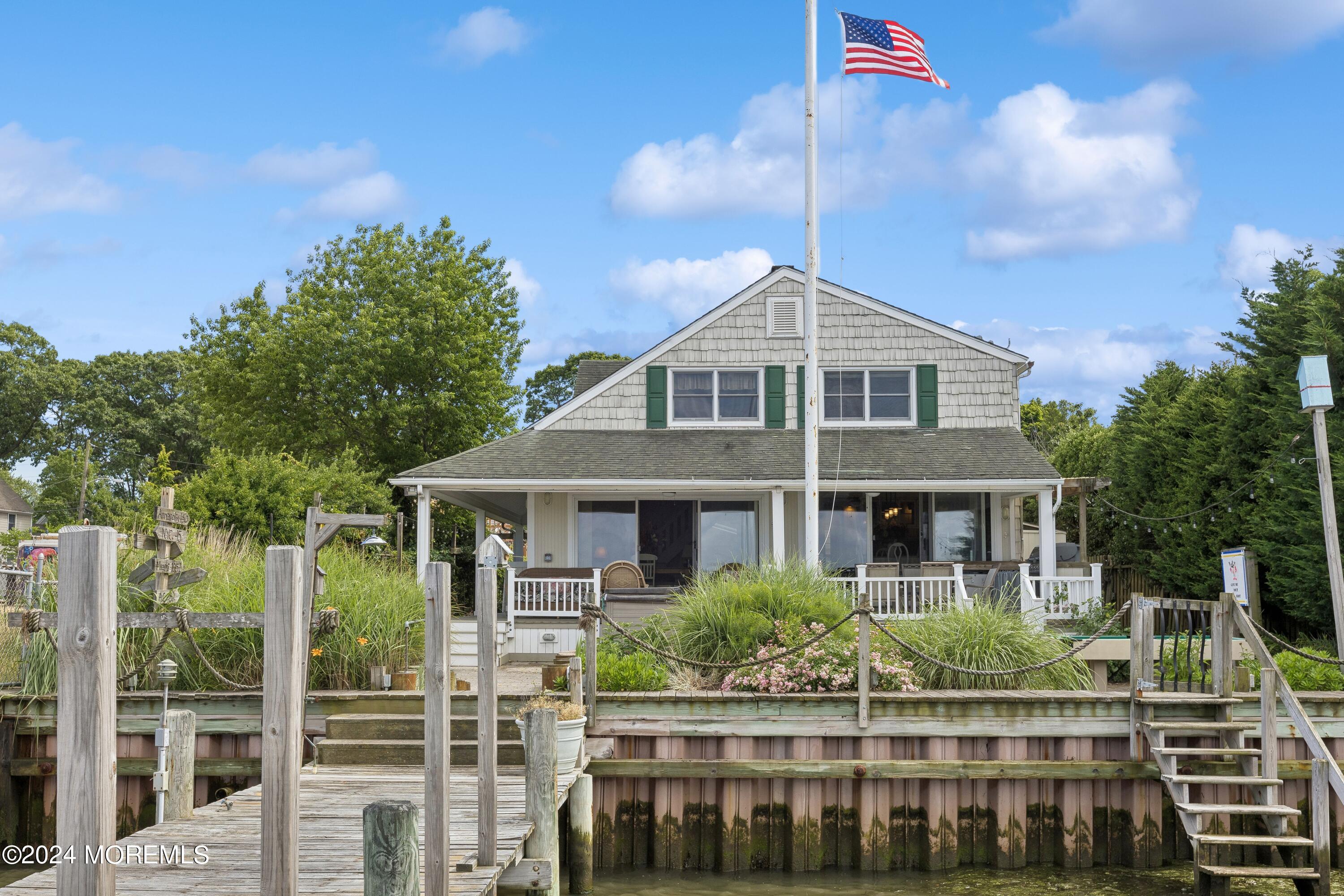 1119 Sampson Road Point Pleasant, NJ 08742 - Photo 2 of 29 a front view of a house with a garden