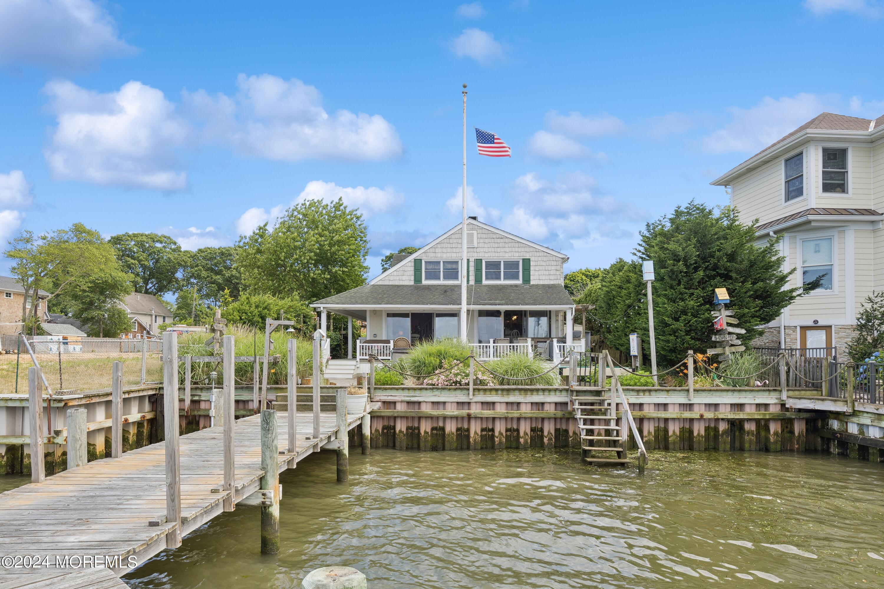 1119 Sampson Road Point Pleasant, NJ 08742 - Photo 29 of 29 a front view of a house with a boat