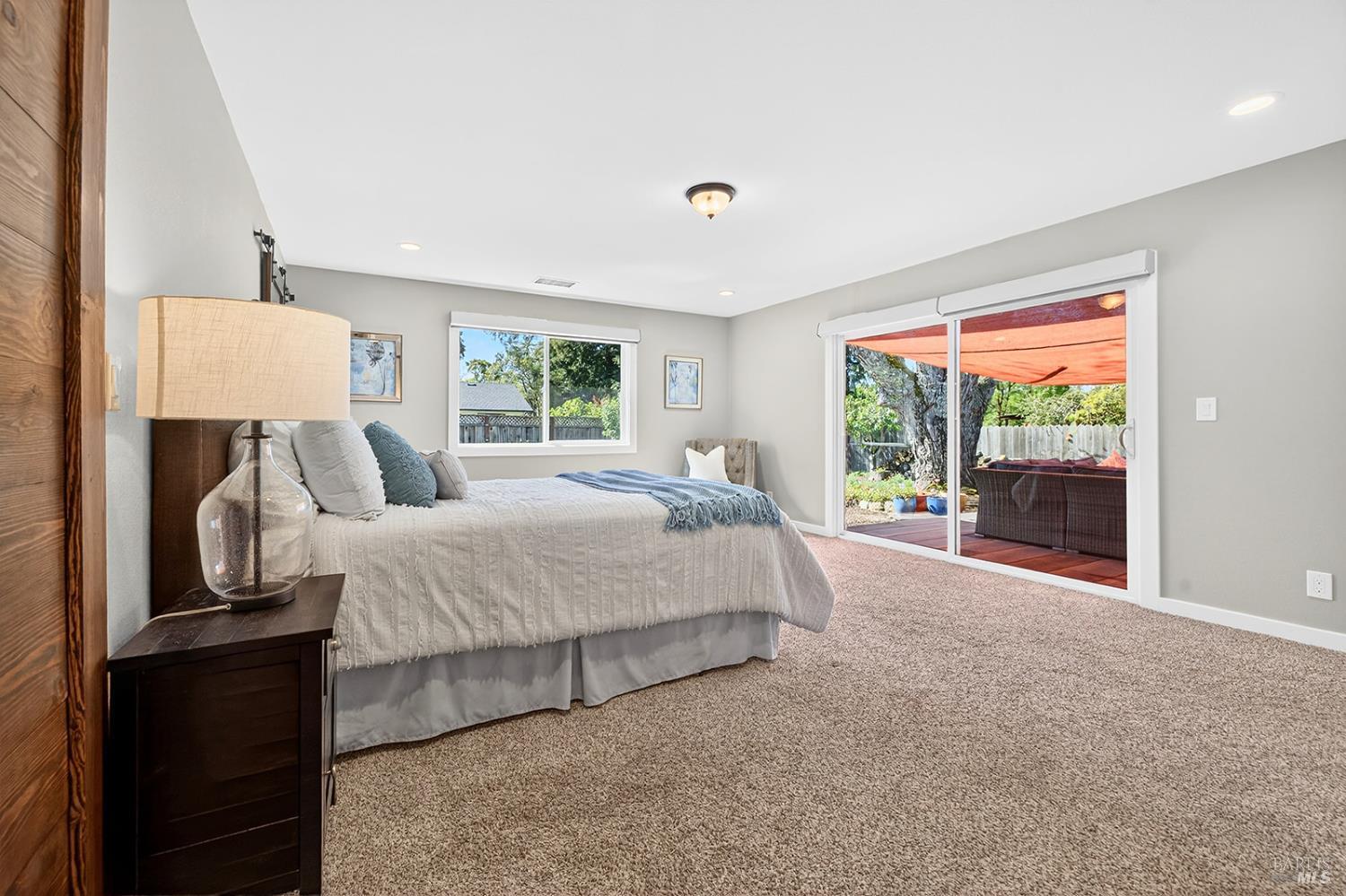 4720 Granada Drive Santa Rosa, CA 95409 - Photo 34 of 68 a bed room with a bed and a night stand